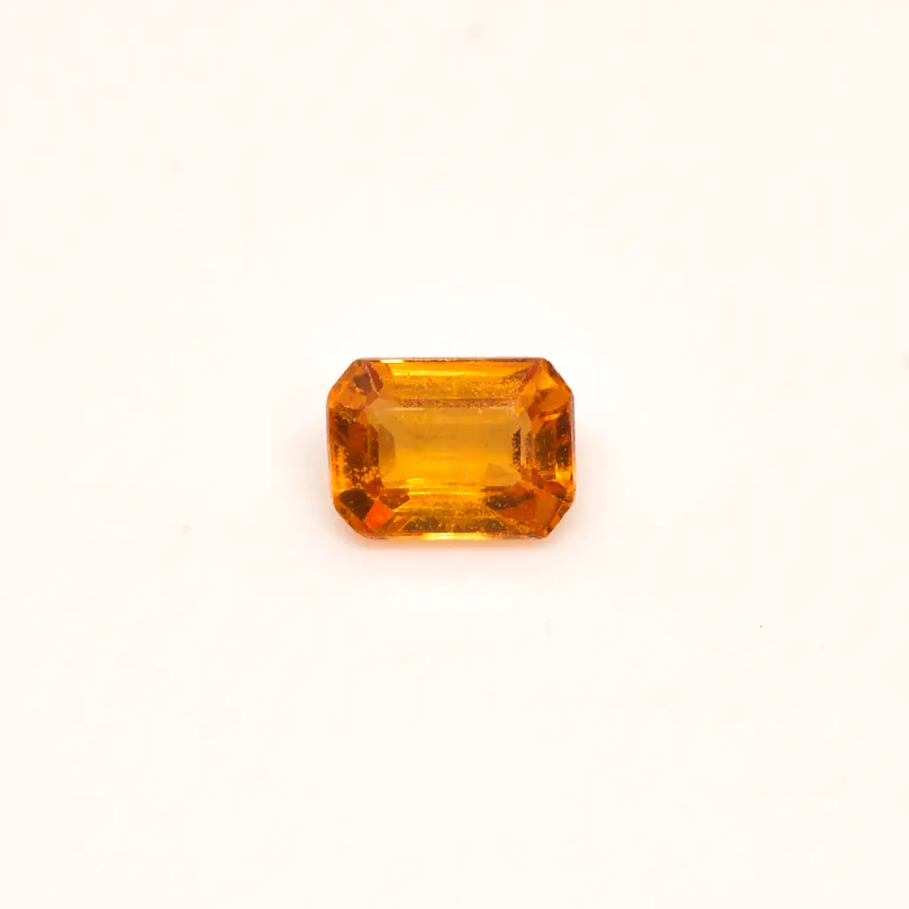 Orange 0.22 ct. Tourmaline in emerald
